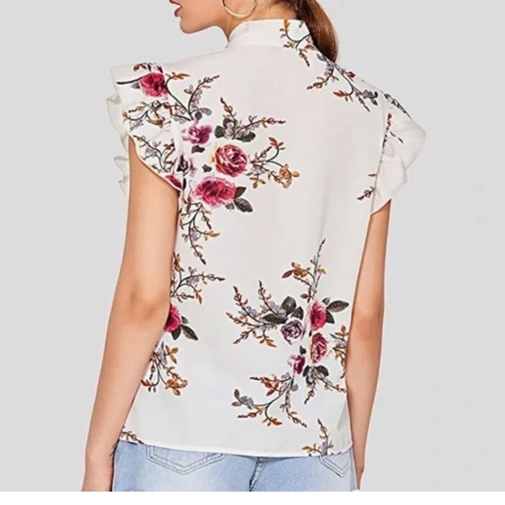Stylish springtime, top sleeveless with ruffle shoulders, and a tie bone neck.
